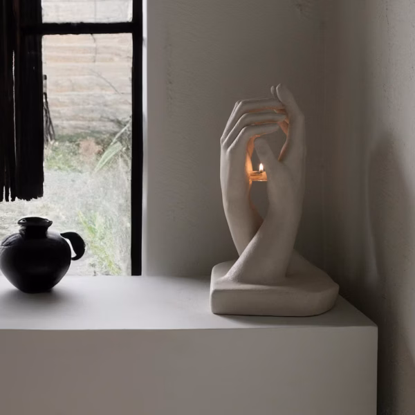 Hands Holding Candle Sculpture