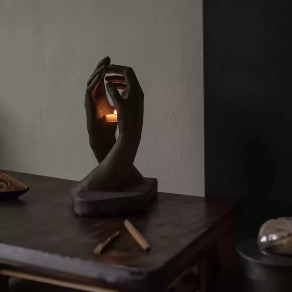 Hands Holding Candle Sculpture
