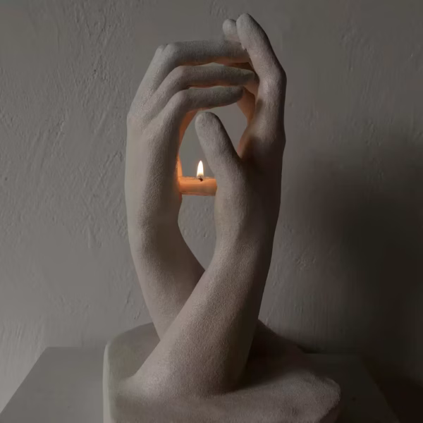 Hands Holding Candle Sculpture