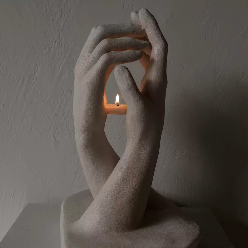 Hands Holding Candle Sculpture